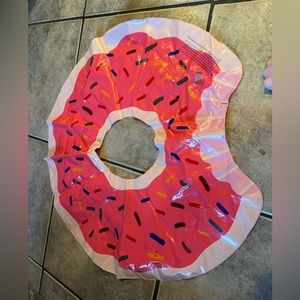 Inflatable float donut with a bite taken out
